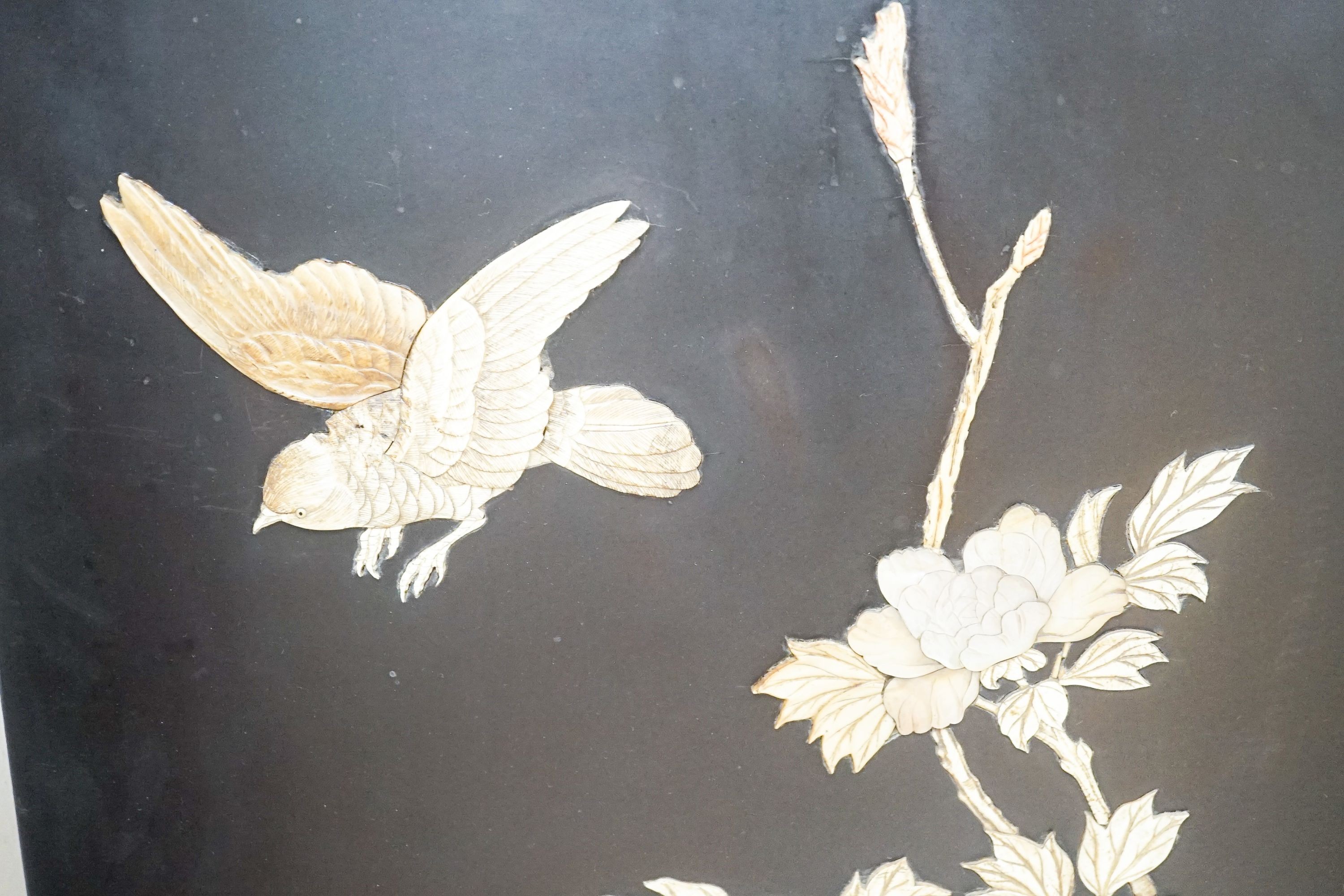 A pair of late 19th century Japanese bone and mother of pearl inlaid shibayama style panels of birds amid flowers, 91 x 51cm